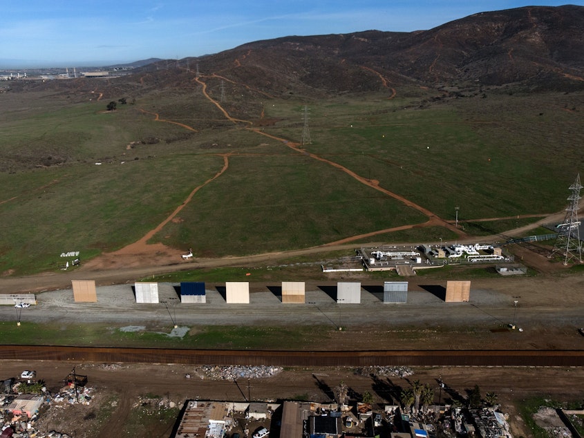 caption: President Trump's border wall prototypes are seen from Tijuana in Baja California state, Mexico, on Monday. Trump has said he may invoke emergency powers to build a border wall if Congress doesn't agree to his demand for funding.