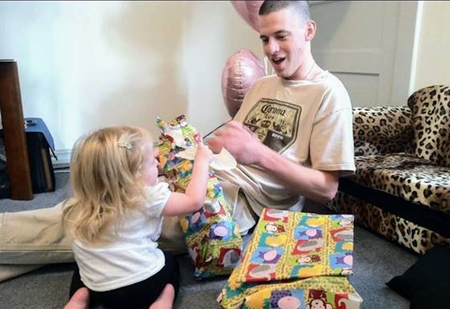 caption: Jeremy Lavender, an Iraq war veteran who struggled with PTSD and traumatic brain injury, at his daughter’s first birthday in 2010. Lavender died after being held at the Chelan County Jail on shoplifting and drug charges seven years later.