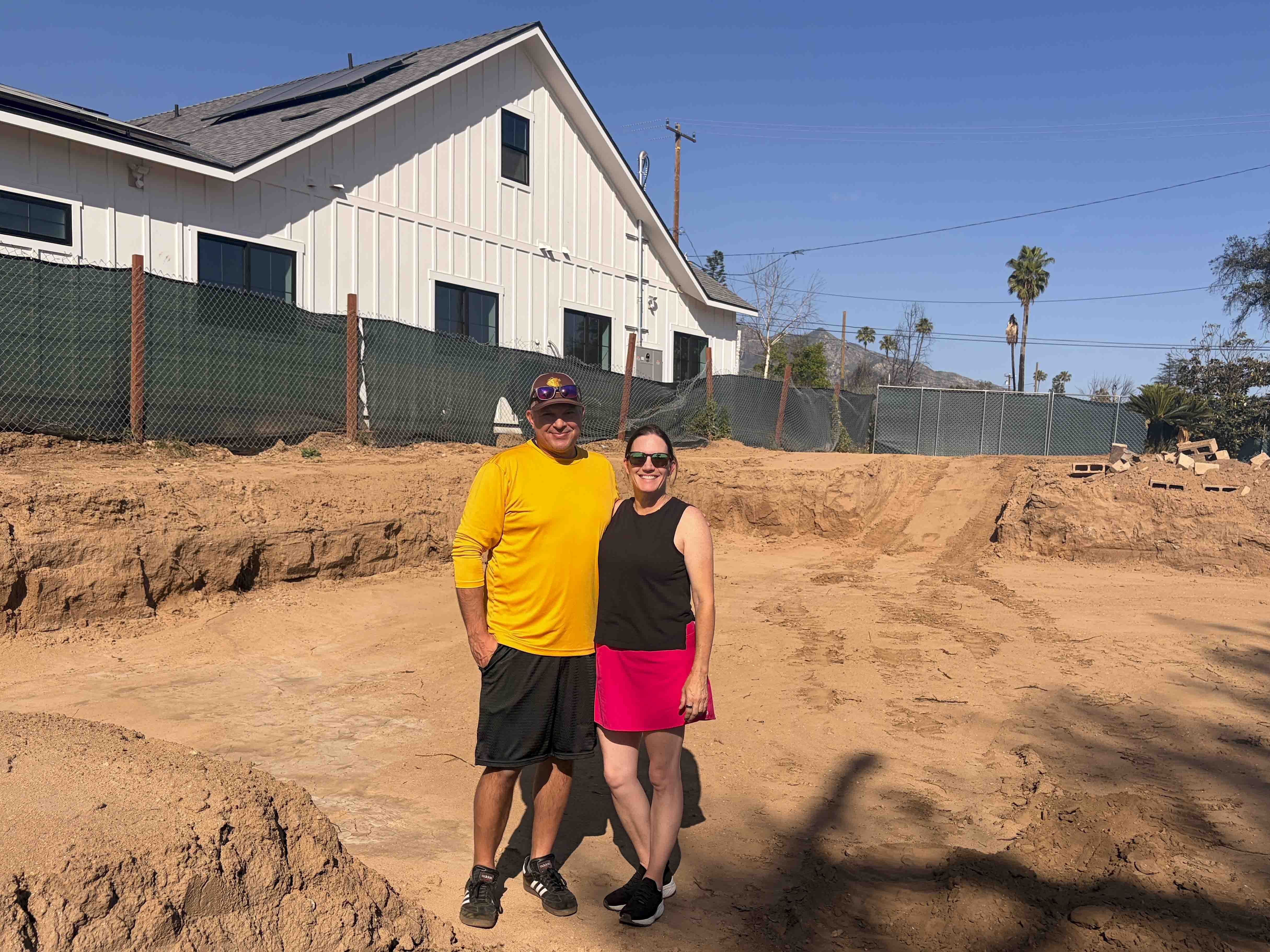caption: Jason and Colleen Warnesky are among the dozens of families in Altadena, Calif., who have opted to rebuild with manufactured homes, following the 2025 Eaton Fire.