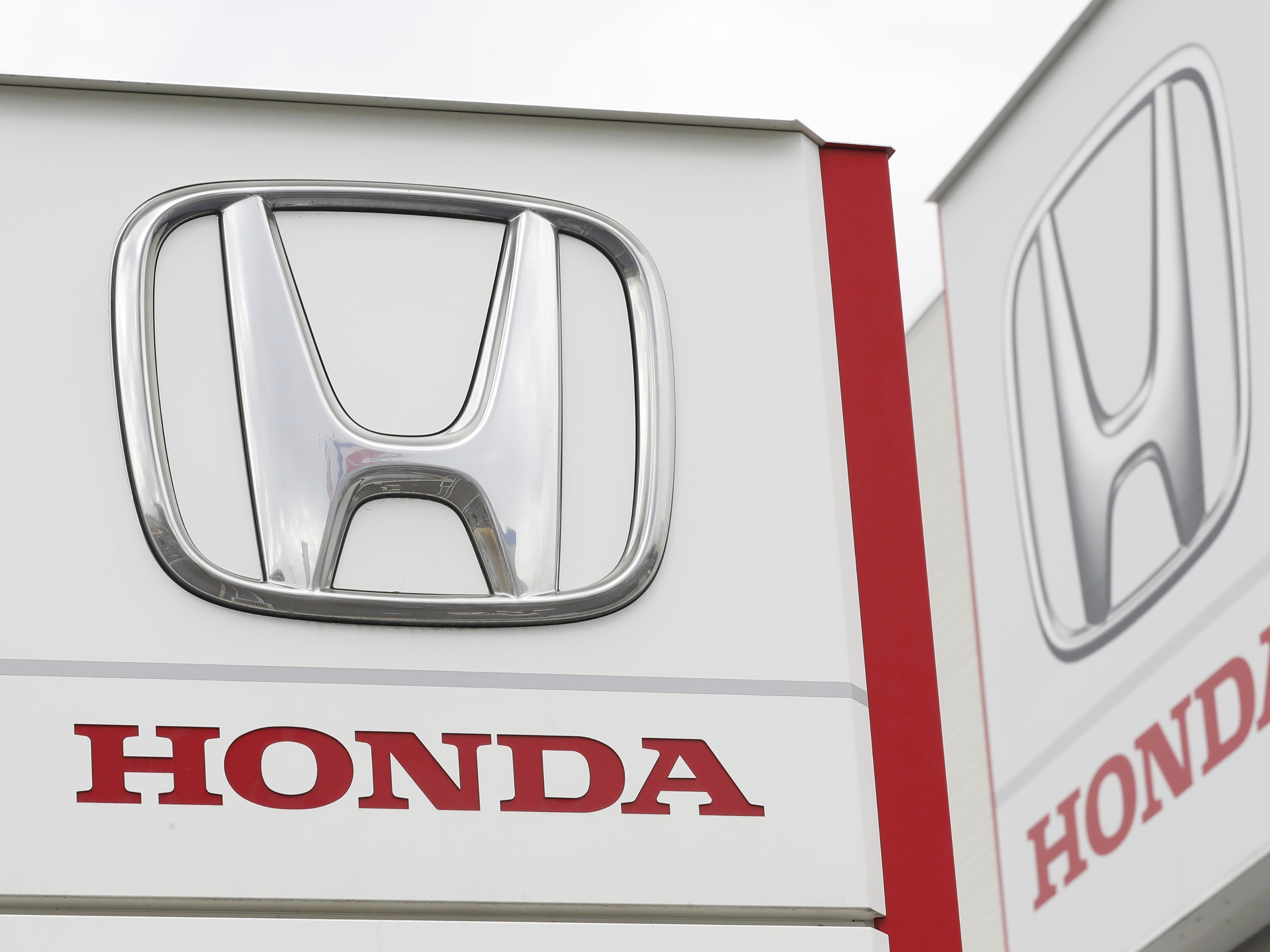 caption: Honda Motor Co. logos are pictured in Tsukuba, northeast of Tokyo, on Feb. 13, 2019. The automaker is recalling more than 700,000 vehicles over fuel pumps that may crack and leak fuel, which could increase the risk of a fire.