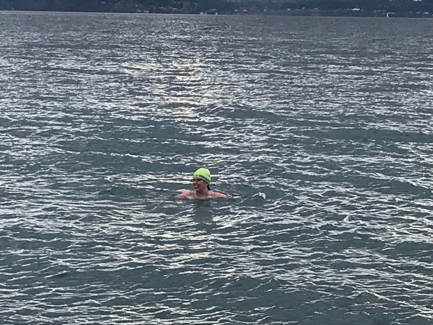 caption: Ari Santander swims at Golden Gardens.