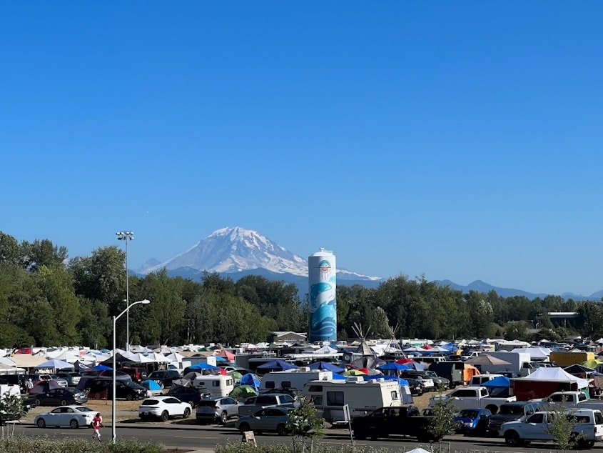 caption: Tahoma, also known as Mt. Rainier, looks over the campers during a weeklong celebration. 