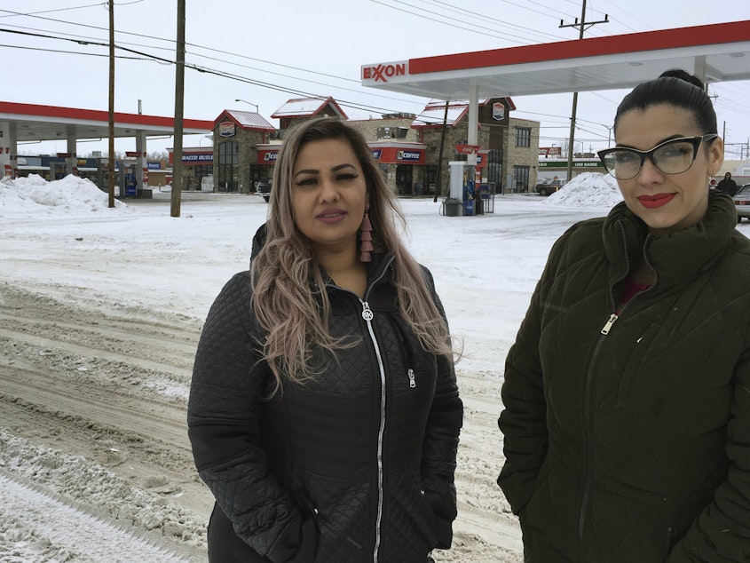 caption: Martha Hernandez, left, and Ana Suda say they were interrupted and detained because they spoke Spanish while shopping for groceries in a convenience store in Havre, Montana. They've now filed a lawsuit. The friends are seen here in front of the store last month.