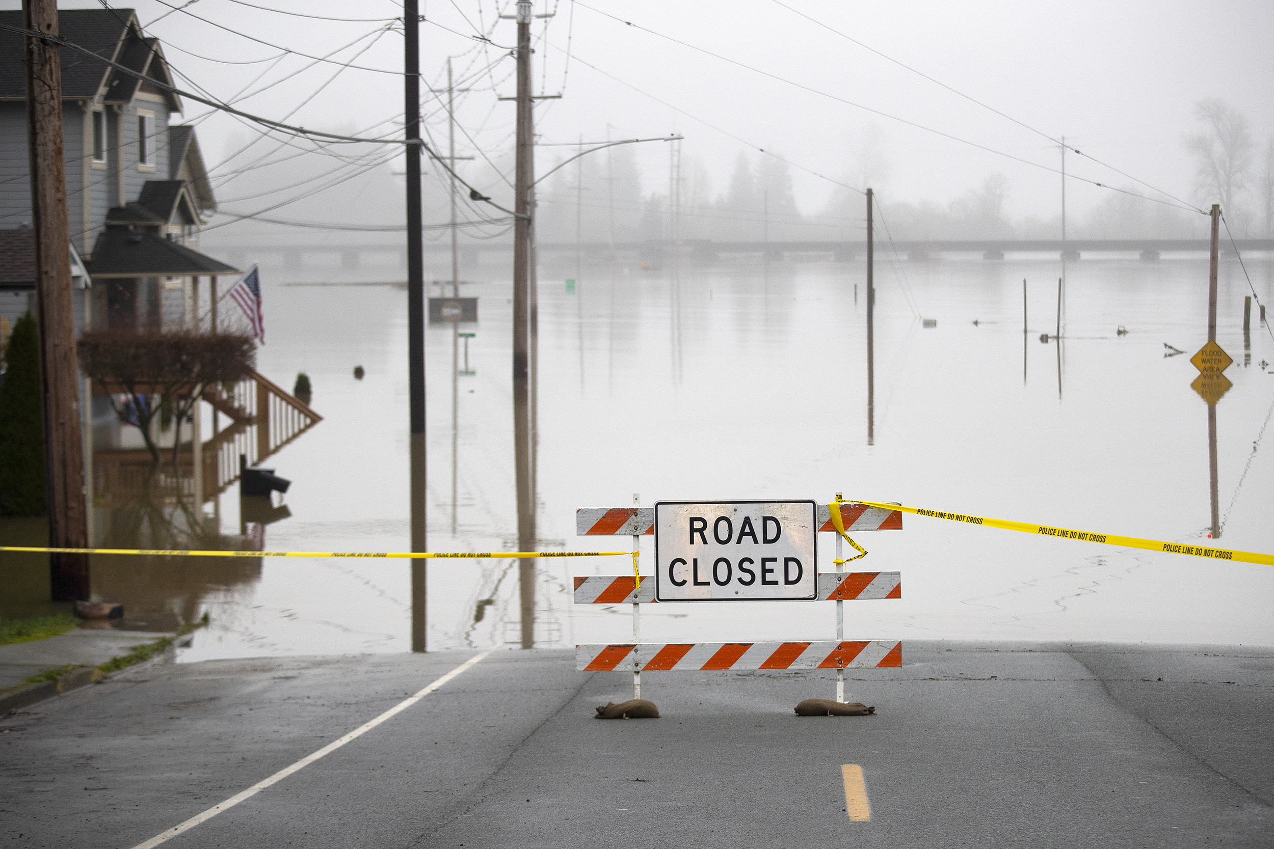 caption: Lincoln Avenue is closed at the intersection of First Street due to flooding as shown on Friday, December 12, 2025, in Snohomish. 