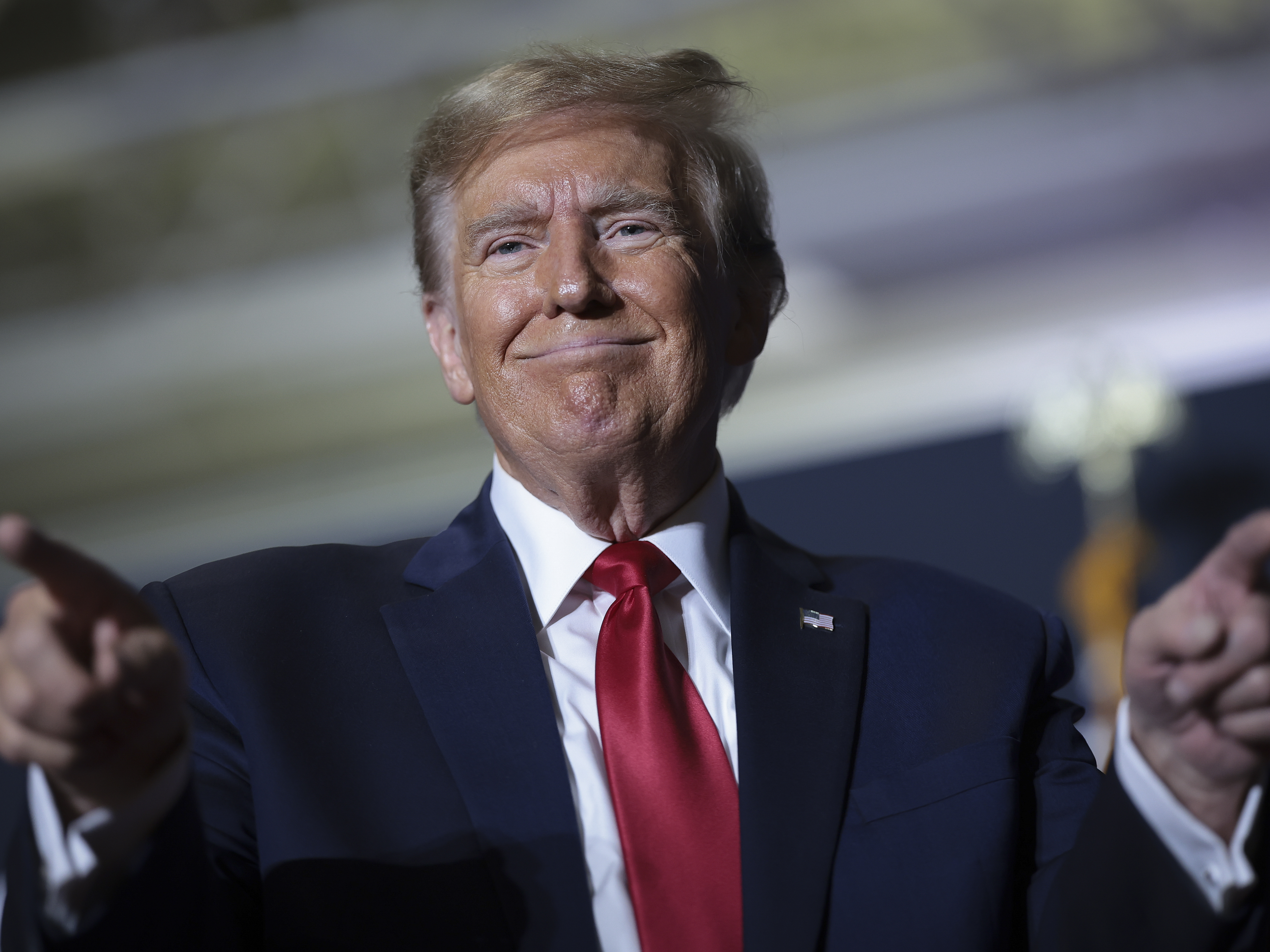 caption: Former President Trump stands to win over $3 billion after his social media company goes public — but he may not be able to cash in immediately.