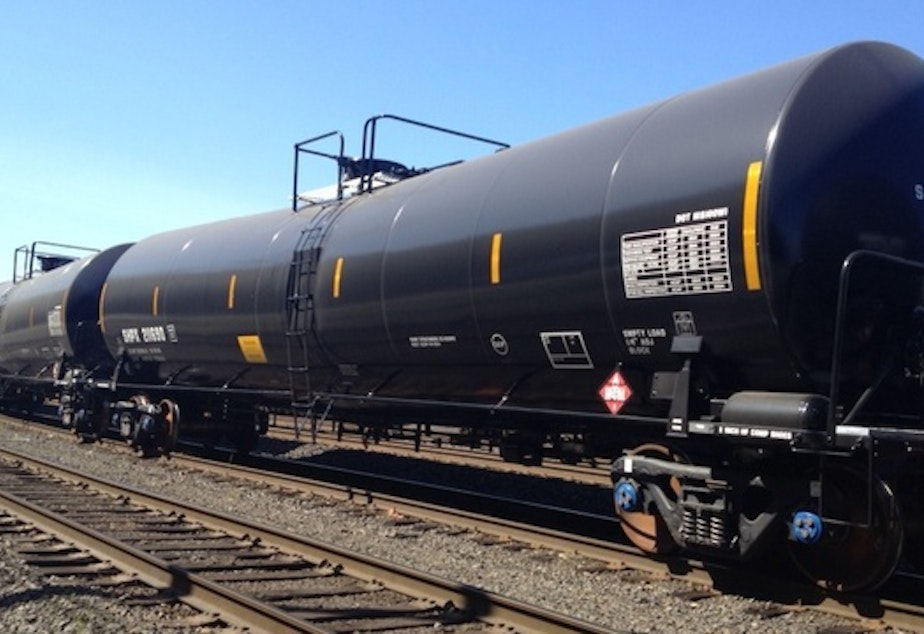 caption: File photo of oil train tankers in a Portland, Ore. railyard.