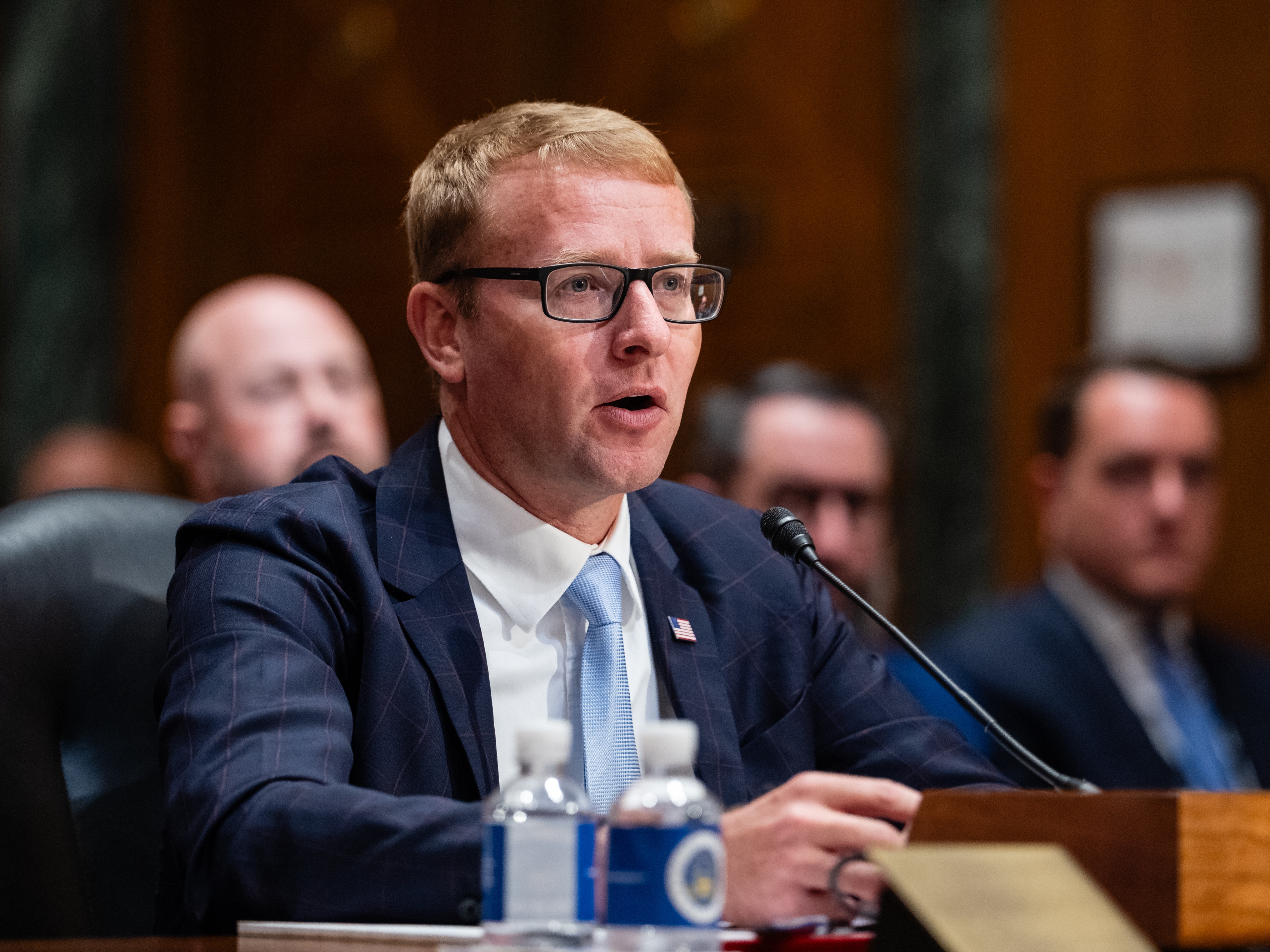 caption: Alex Adams, assistant secretary of the Department of Health and Human Services, during his Senate Finance Committee confirmation hearing in Washington, D.C., on July 22, 2025.