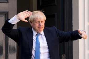 caption: Boris Johnson is now the U.K.'s incoming prime minister, after winning a party election. He's seen here arriving at the Conservative party's headquarters in central London on Tuesday.
