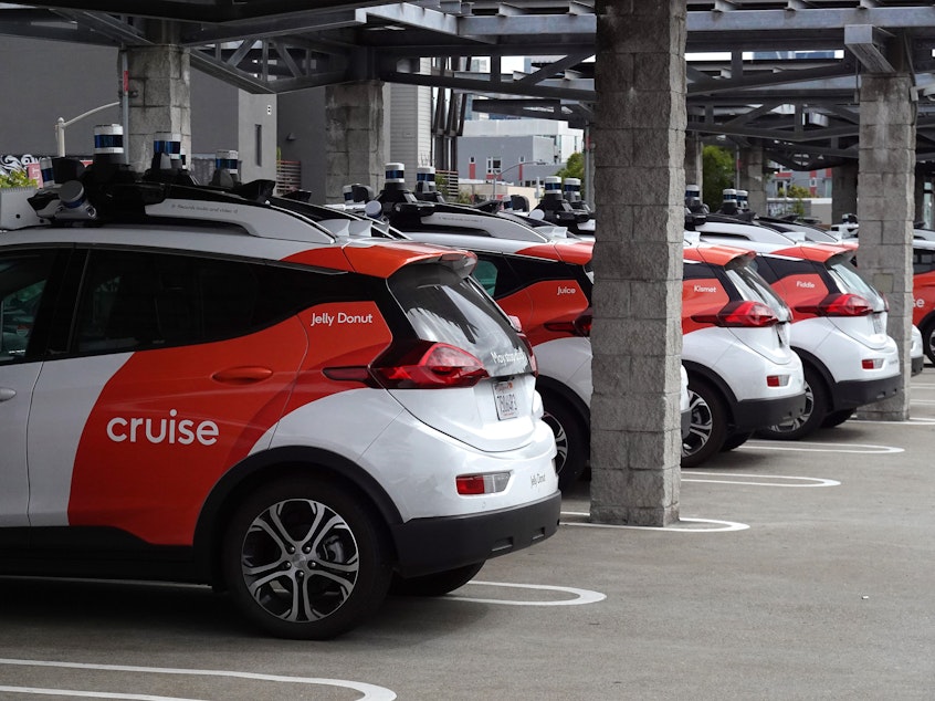 caption: Cruise autonomous vehicles sit parked in a lot in June 2023 in San Francisco, Calif. The company's fleet of robotaxis have not been operating for the past few months, after the company's response to a crash in October raised concerns with regulators.