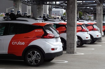 caption: Cruise autonomous vehicles sit parked in a lot in June 2023 in San Francisco, Calif. The company's fleet of robotaxis have not been operating for the past few months, after the company's response to a crash in October raised concerns with regulators.