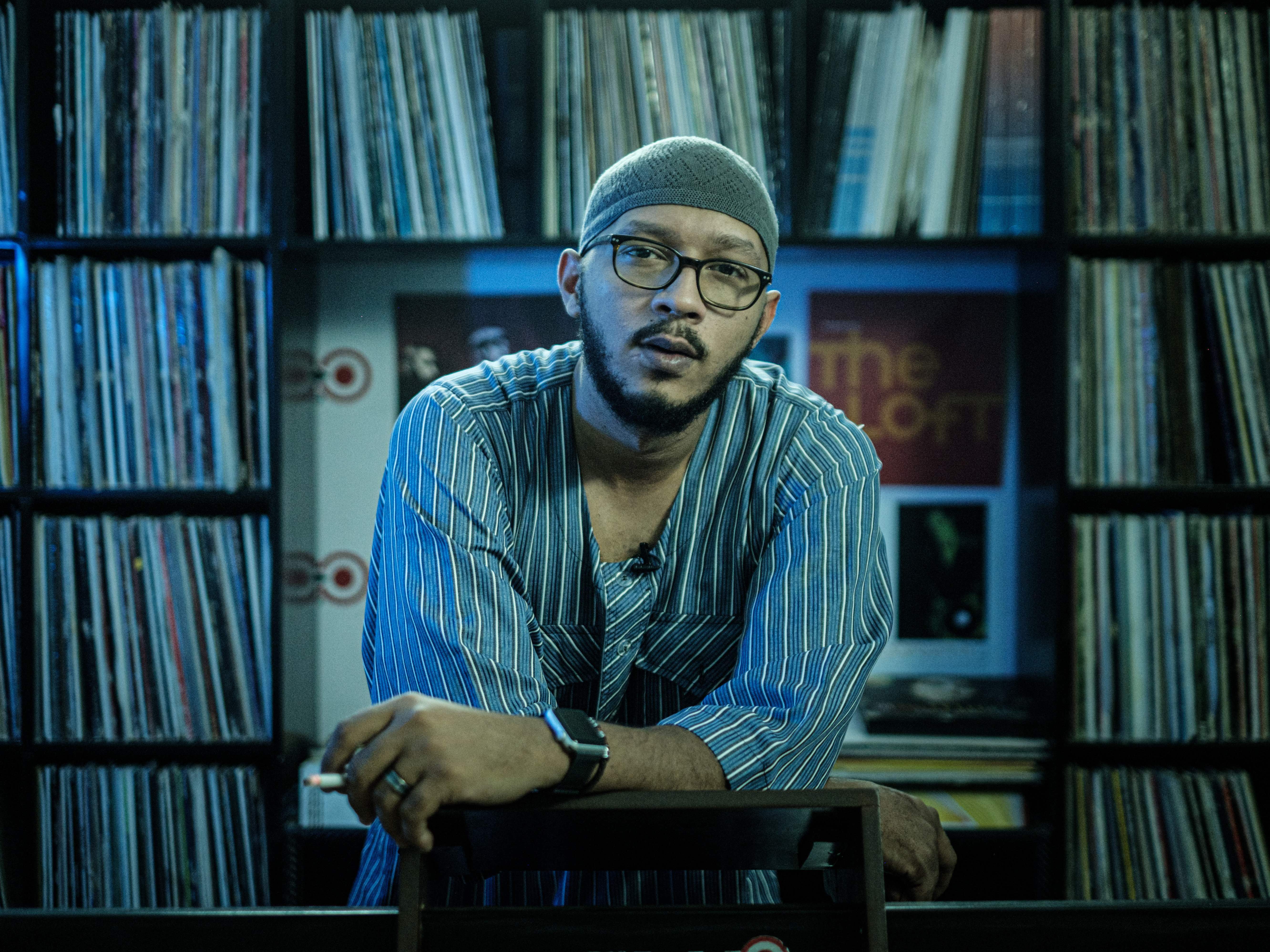 caption: "I'm trying to keep hope, because everyone is leaving, bro," says Ahmad Hikmat, Content Director of Capital FM in Khartoum. "I am losing my team one by one."