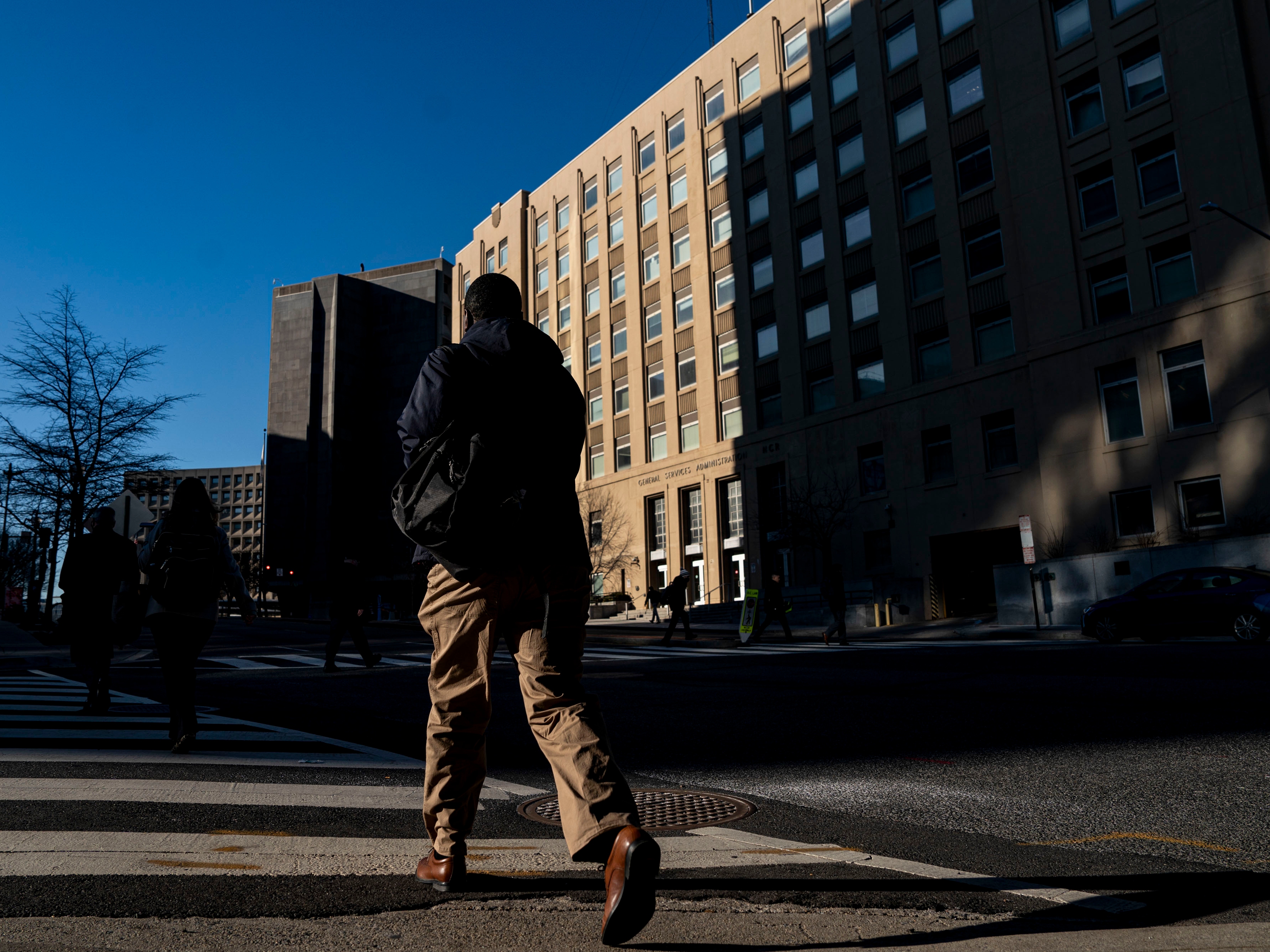 caption: The General Services Administration, which manages federal real estate, is identifying property to divest, and the agency has abruptly fired more than 1,000 workers and is targeting an overall 63% reduction in headcount at its Public Building Service division.