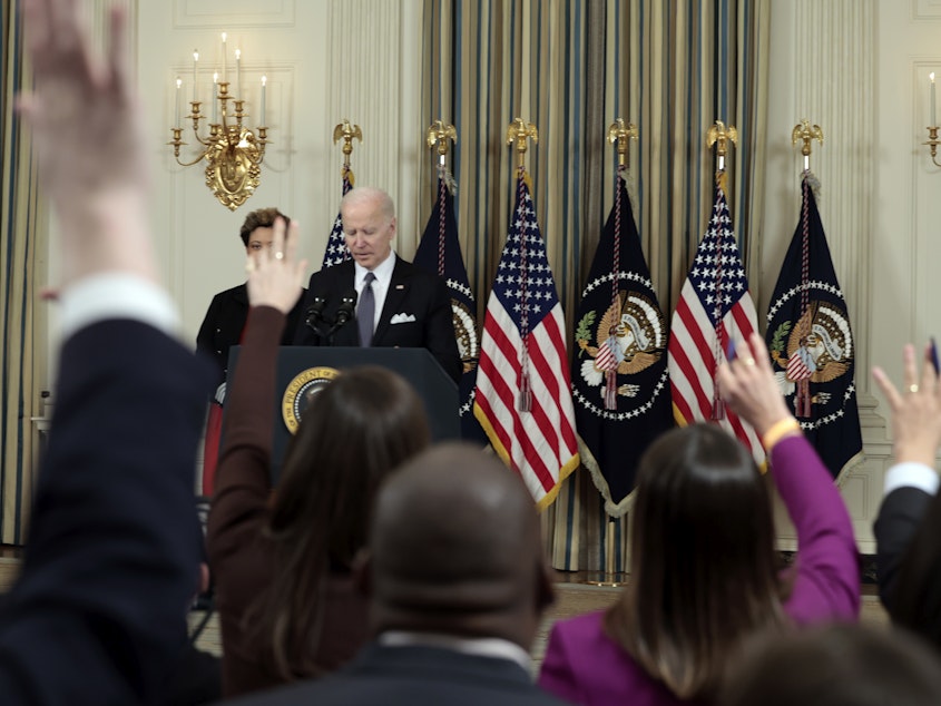 caption: President Joe Biden takes questions from the media alongside Director of the Office of Management and Budget Shalanda Young as he introduces his budget request for fiscal year 2023.