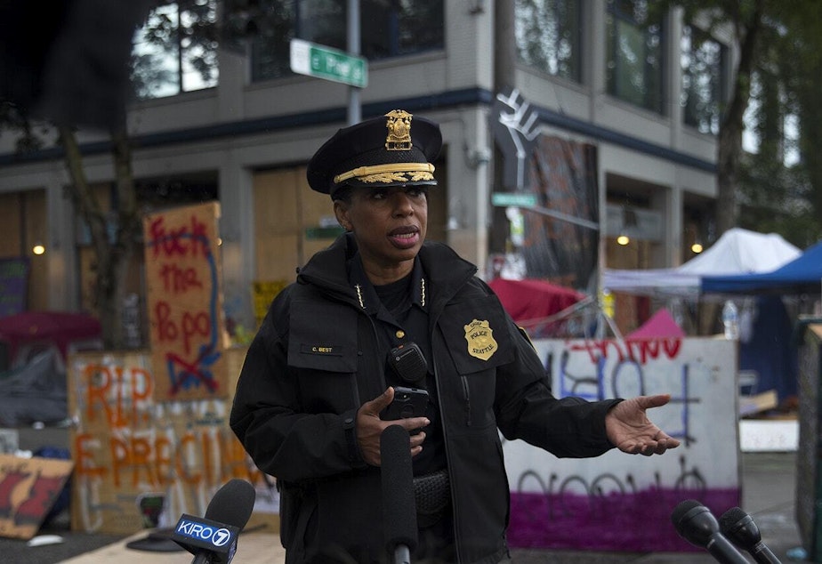 caption: Seattle Police Chief Carmen Best holds a press briefing after the Capitol Hill Organized Protest zone was cleared by Seattle Police Department officers early Wednesday morning, July 1, 2020, at the intersection of 12th Avenue and East Pine Street in Seattle.