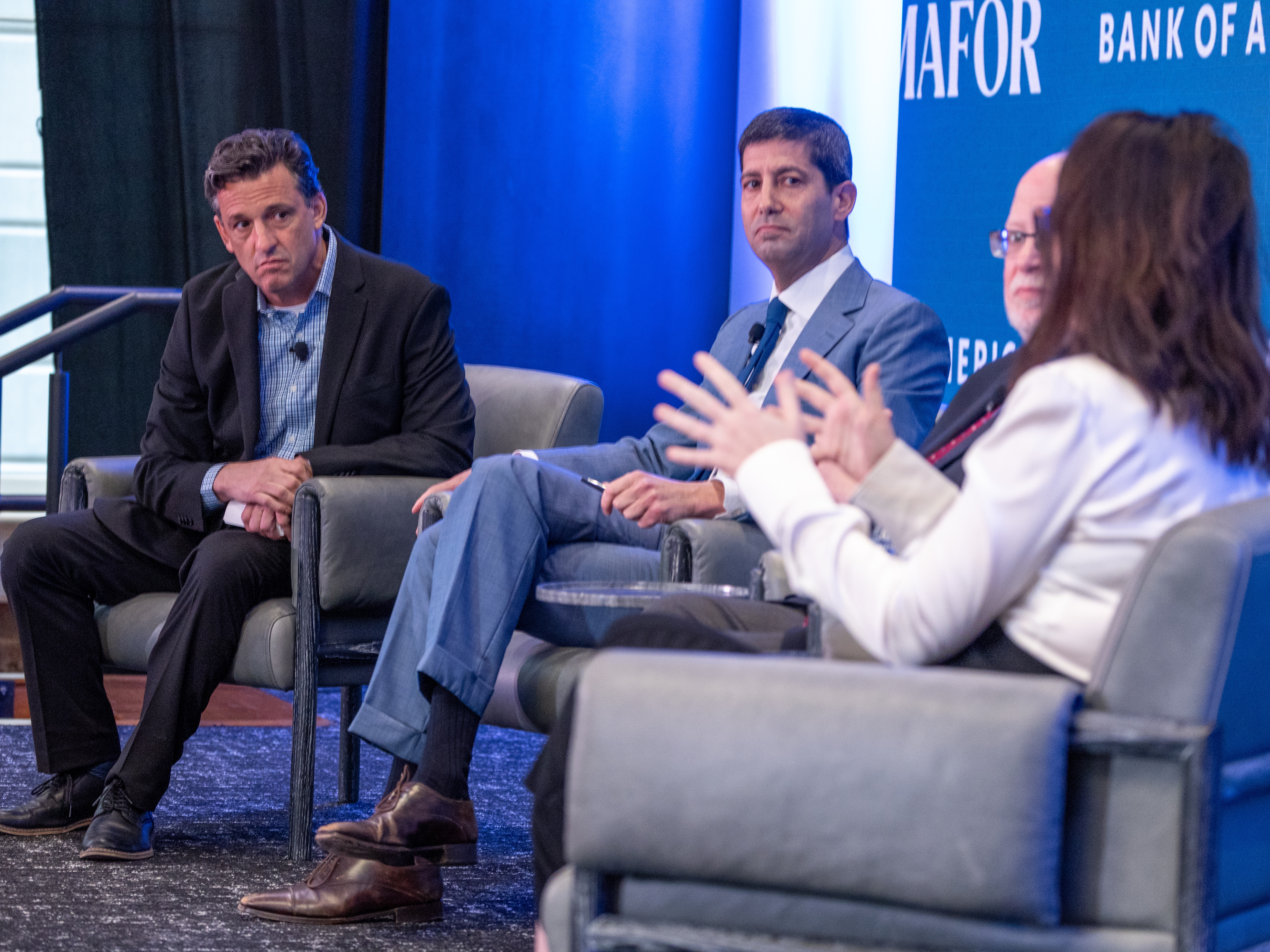 caption: Kevin Warsh (center) is President Trump's pick to lead the Federal Reserve.  Warsh is a former Fed governor who has echoed the president's call for lower interest rates.