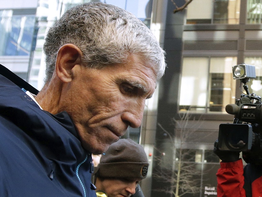 caption: In this March 12, 2019, file photo, William "Rick" Singer, founder of the Edge College & Career Network, departs federal court in Boston after pleading guilty to charges in a nationwide college admissions bribery scandal.