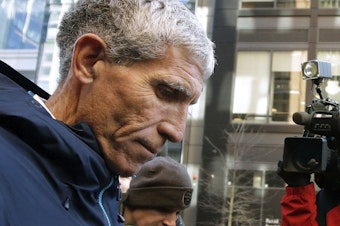 caption: In this March 12, 2019, file photo, William "Rick" Singer, founder of the Edge College & Career Network, departs federal court in Boston after pleading guilty to charges in a nationwide college admissions bribery scandal.
