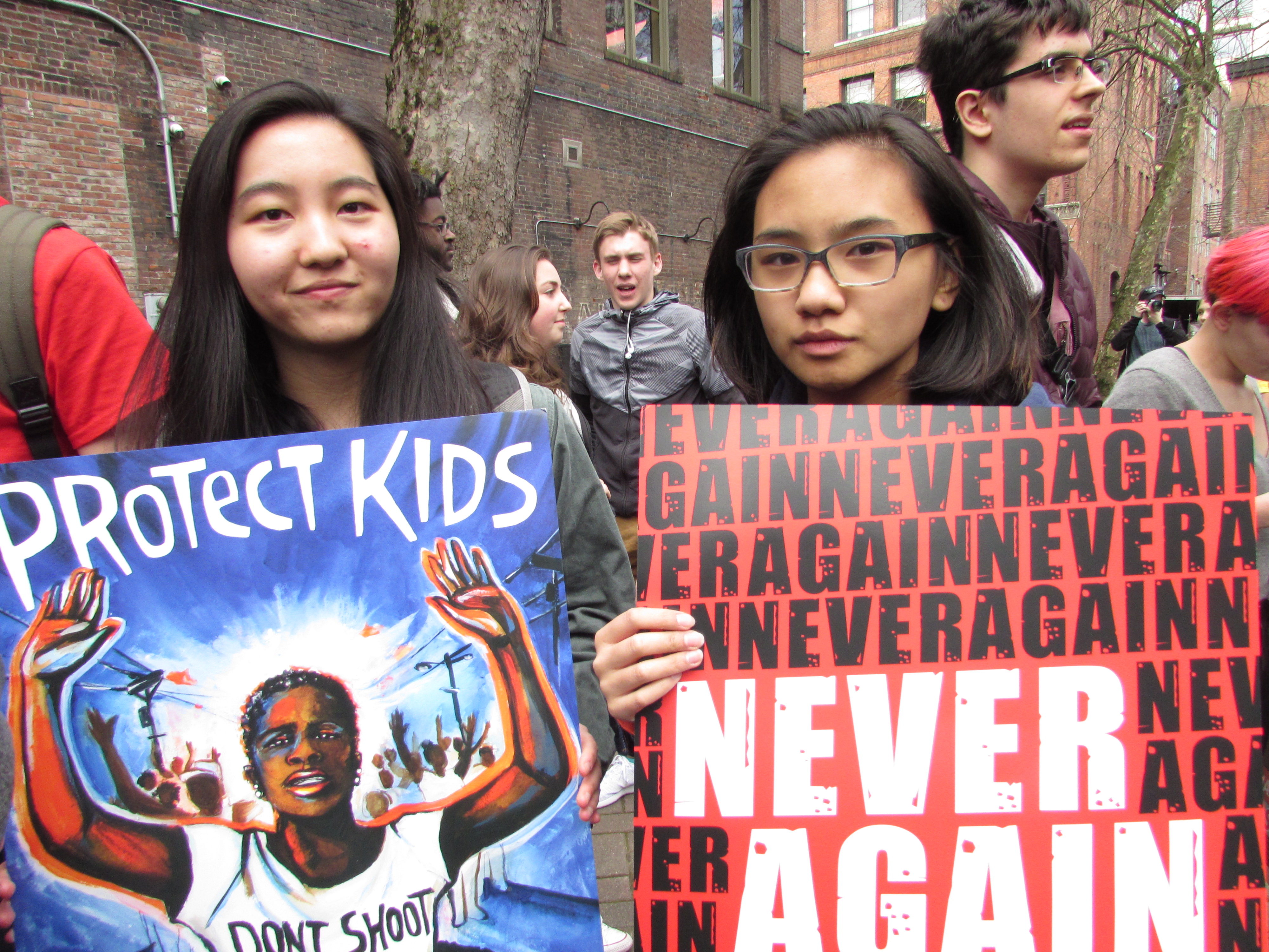 caption: Ginny Sunde and Erin Magarro in Seattle's Occidental Square. They attend Raisbeck Aviation High School. 