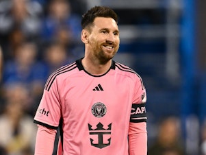 caption: Lionel Messi #10 of Inter Miami smiles in the game against CF Montréal during the first half at Saputo Stadium on May 11 in Montreal, Canada.