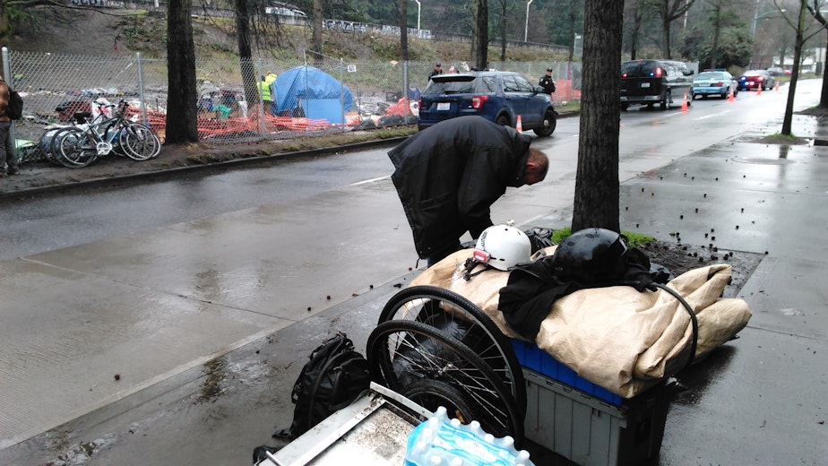 caption: George Kerns is moving to another homeless camp. He knows it won't be the last time he's told to move on