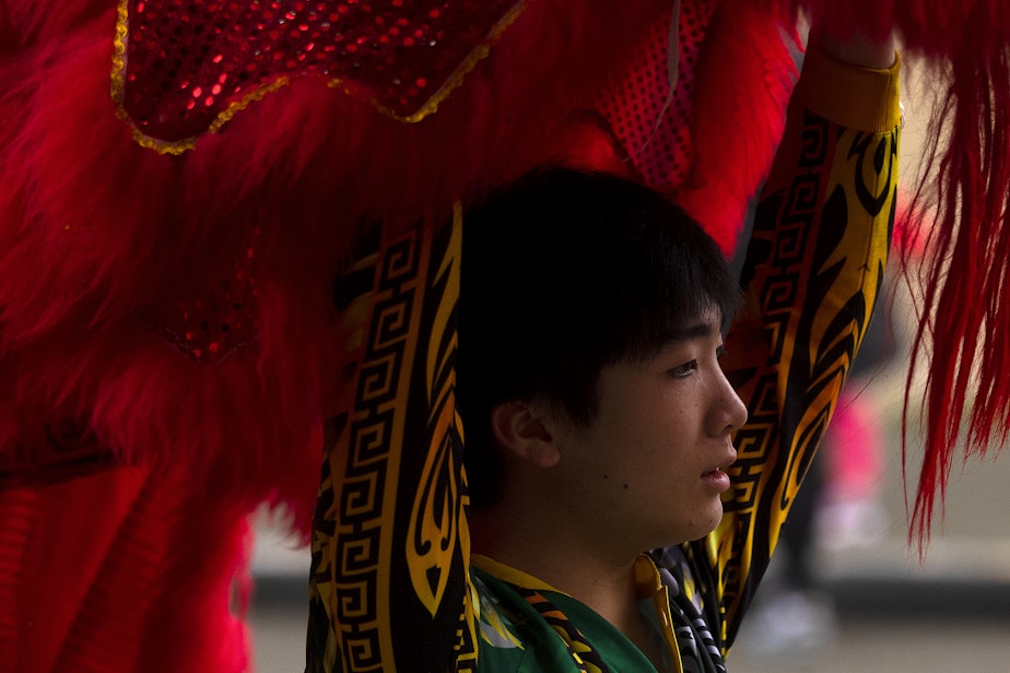caption: Mak Fai Dragon and Lion dancer Ethan Lee, 19, performs during the Lunar New Year celebration on Saturday, Feb. 4, 2023, in Seattle’s Chinatown-International District. 