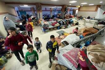 caption: Thousands of Palestinians have taken shelter at the Nasser Medical Complex in Khan Younis, Gaza Strip, as Israeli forces press an offensive nearby.