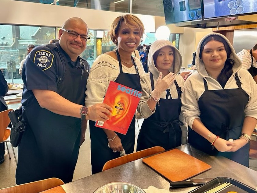 caption: Seattle Police Chief Adrian Diaz and former Police Chief Carmen Best pose with a couple teenagers during the Cooking with the Chief event on Saturday, Nov. 4. This event is funded by a grant in partnership with Seattle Magazine and PCC.