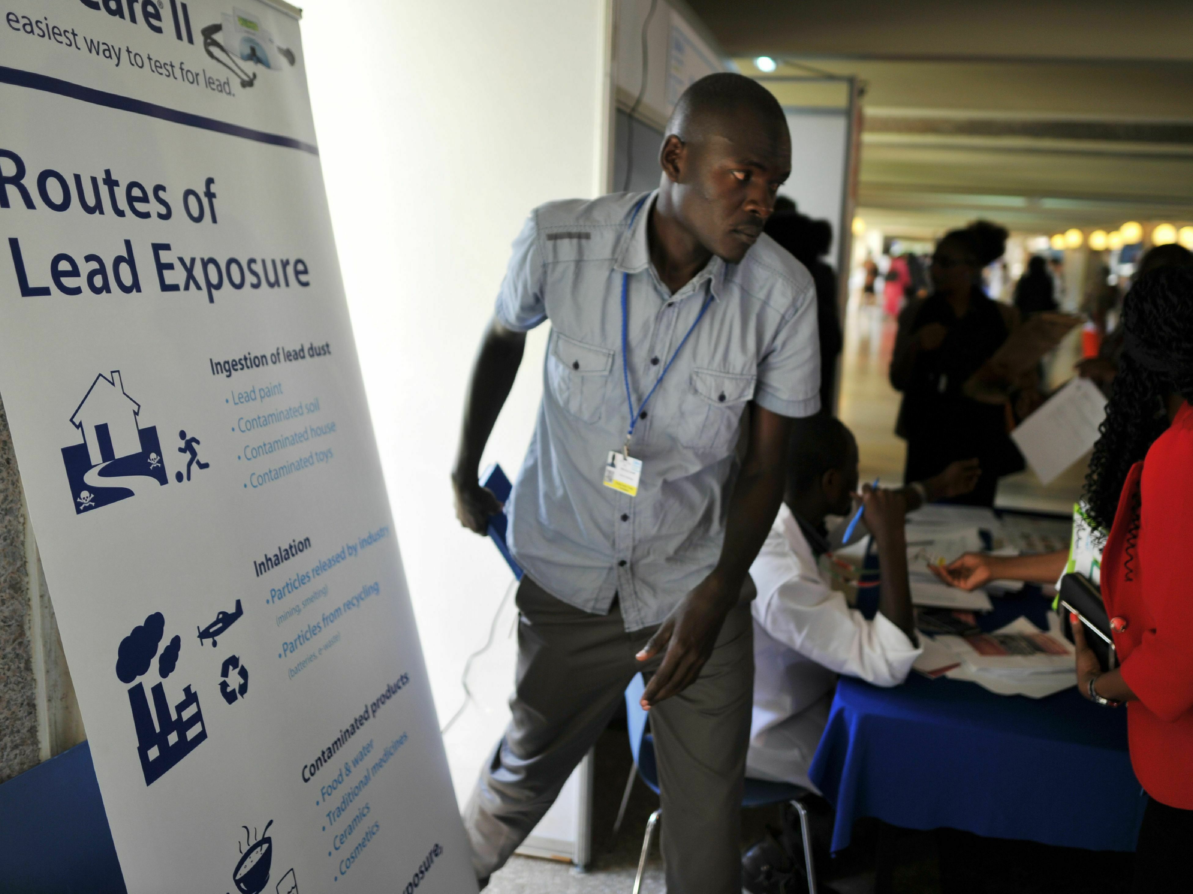 caption: Lead poisoning is now getting more attention — and funds to fight it. Above: At a U.N. conference in Kenya, a booth offers information about testing and treatment.