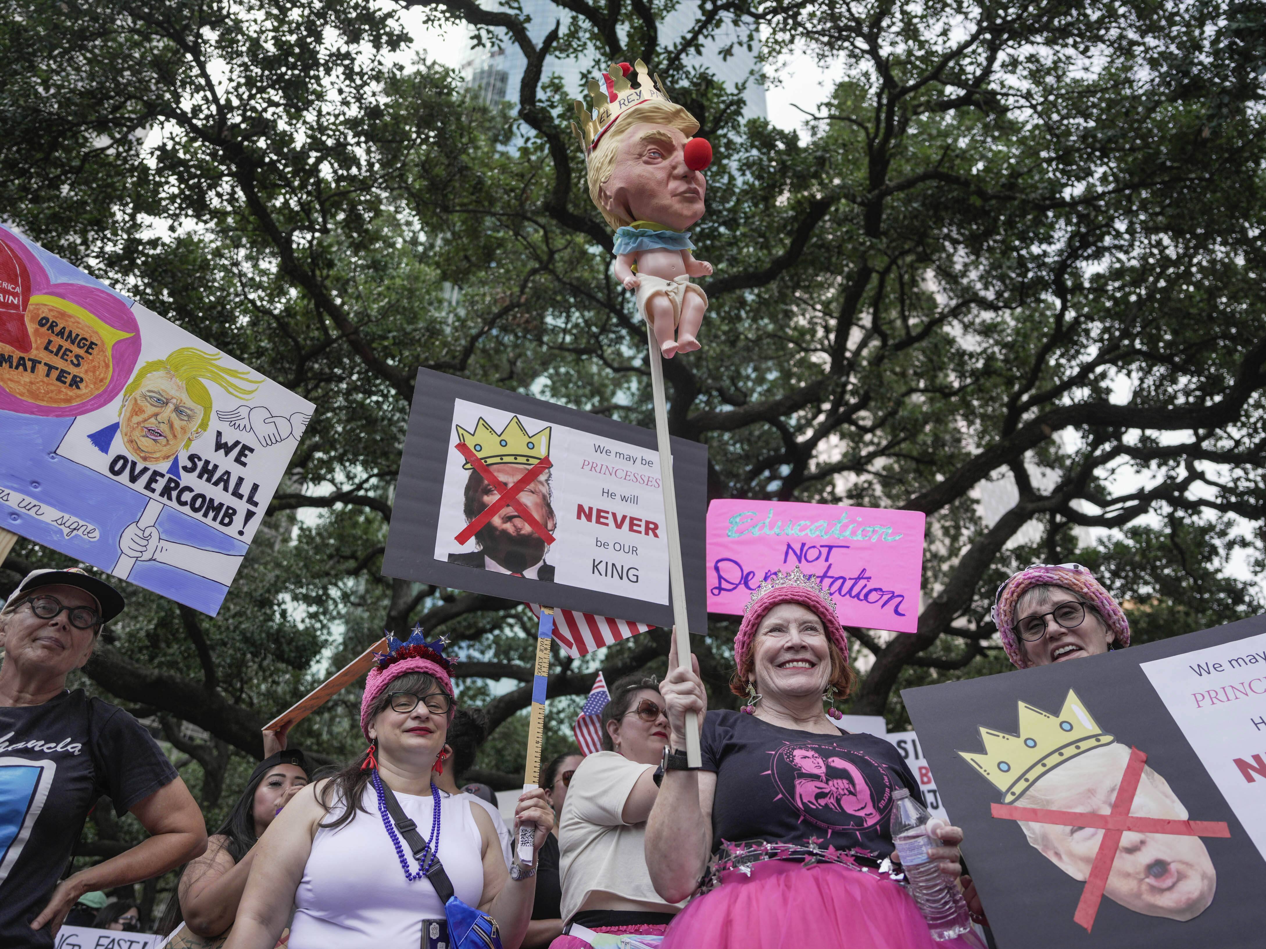 caption: Houston: People gather in Houston for the No Kings nationwide demonstration.