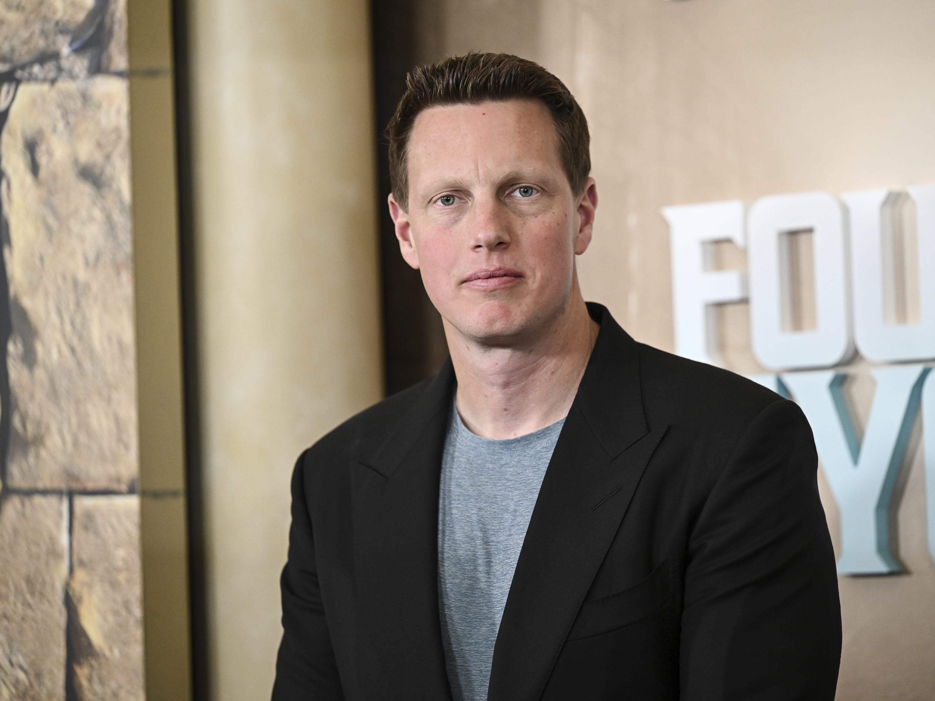 caption: Paramount, led by CEO David Ellison, has launched a hostile takeover bid for Warner Bros. after it agreed to sell its film and television studio properties to Netflix.