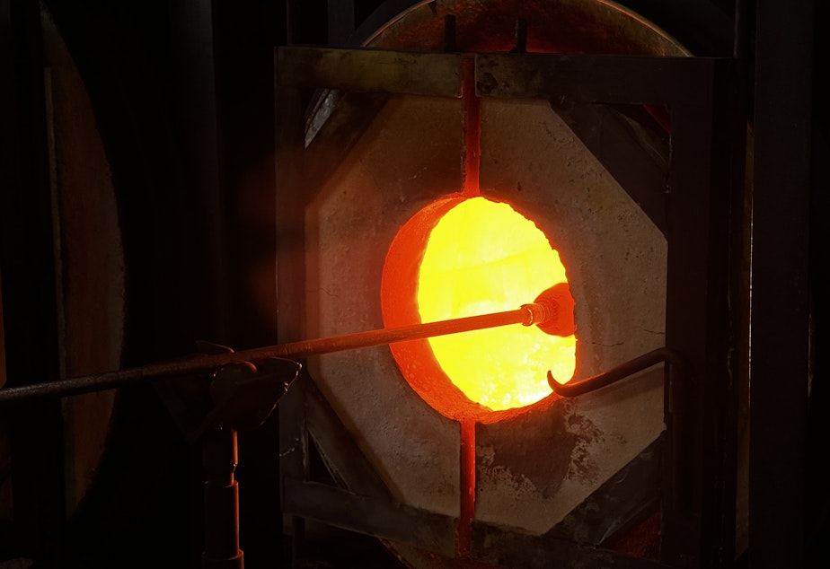 caption: Glass is inserted into the kiln, which always stays on to keep its heat constant.
