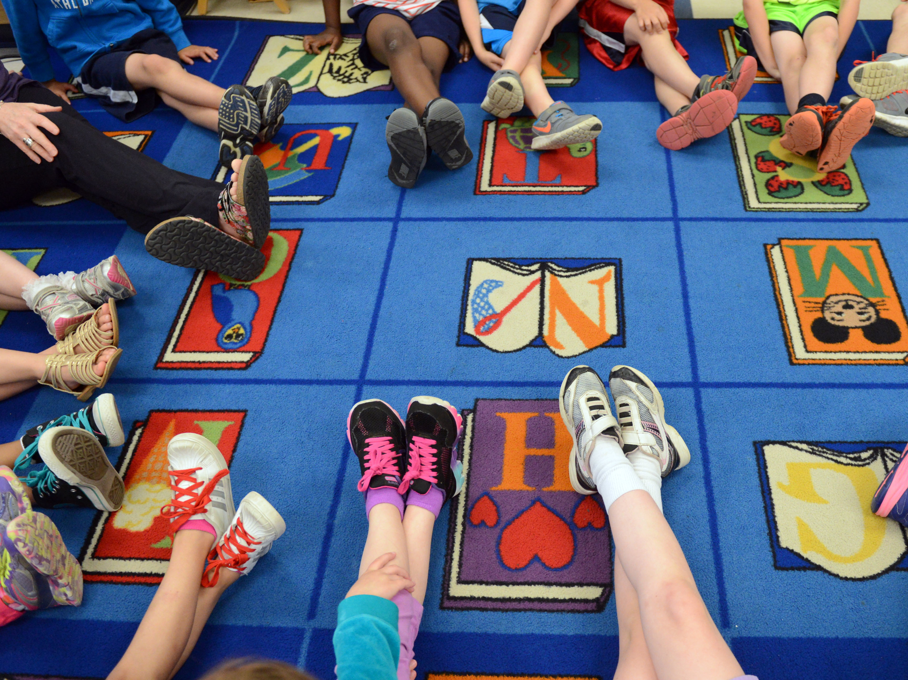 caption: The new law will allow Alabama public schools to offer yoga for students. Here, kids participate in a yoga class in Pennsylvania.