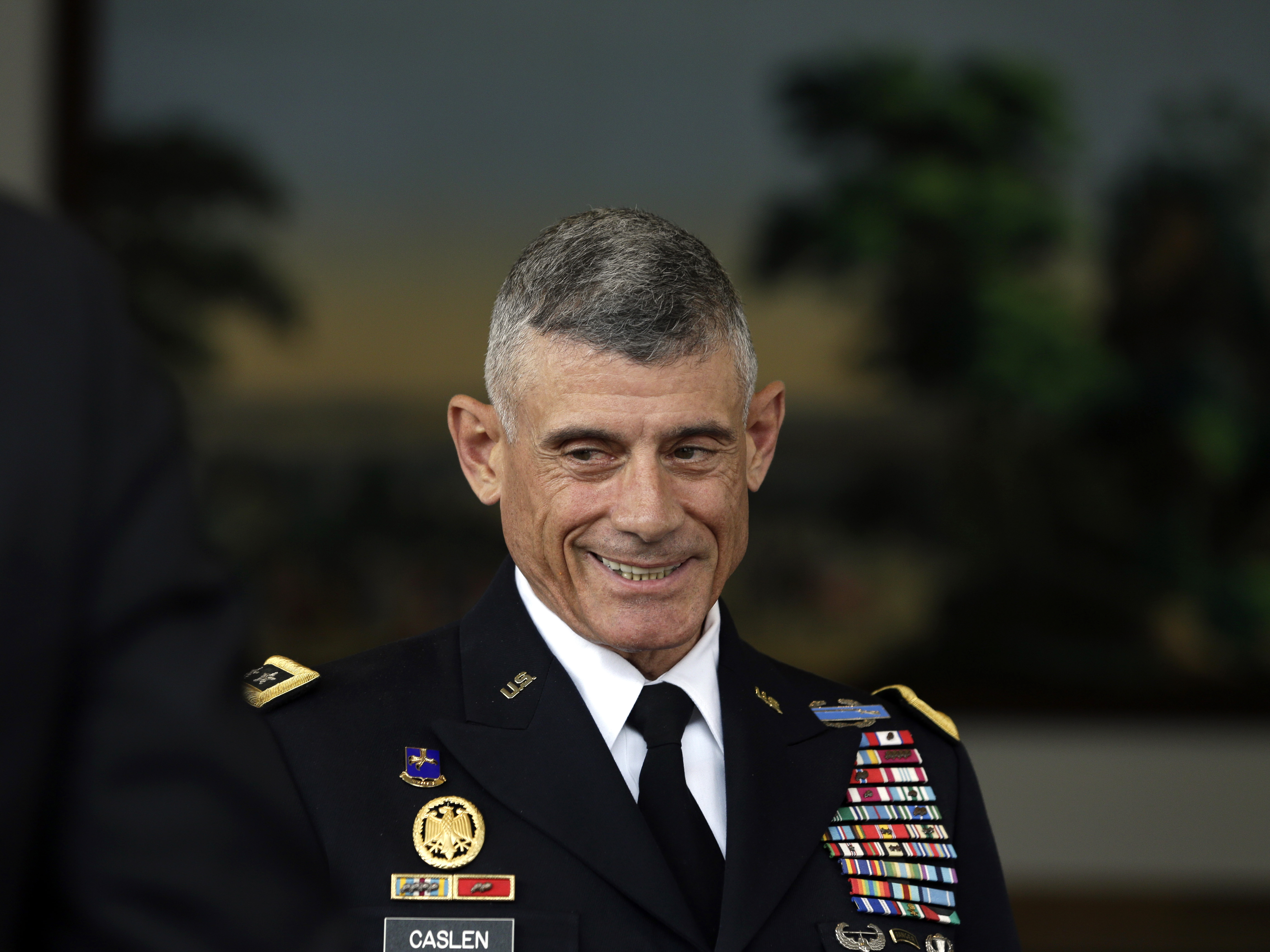 caption: Retired Army Lt. Gen. Robert Caslen, pictured in 2014 when he was superintendent of the U.S. Military Academy, resigned Wednesday as president of the University of South Carolina.