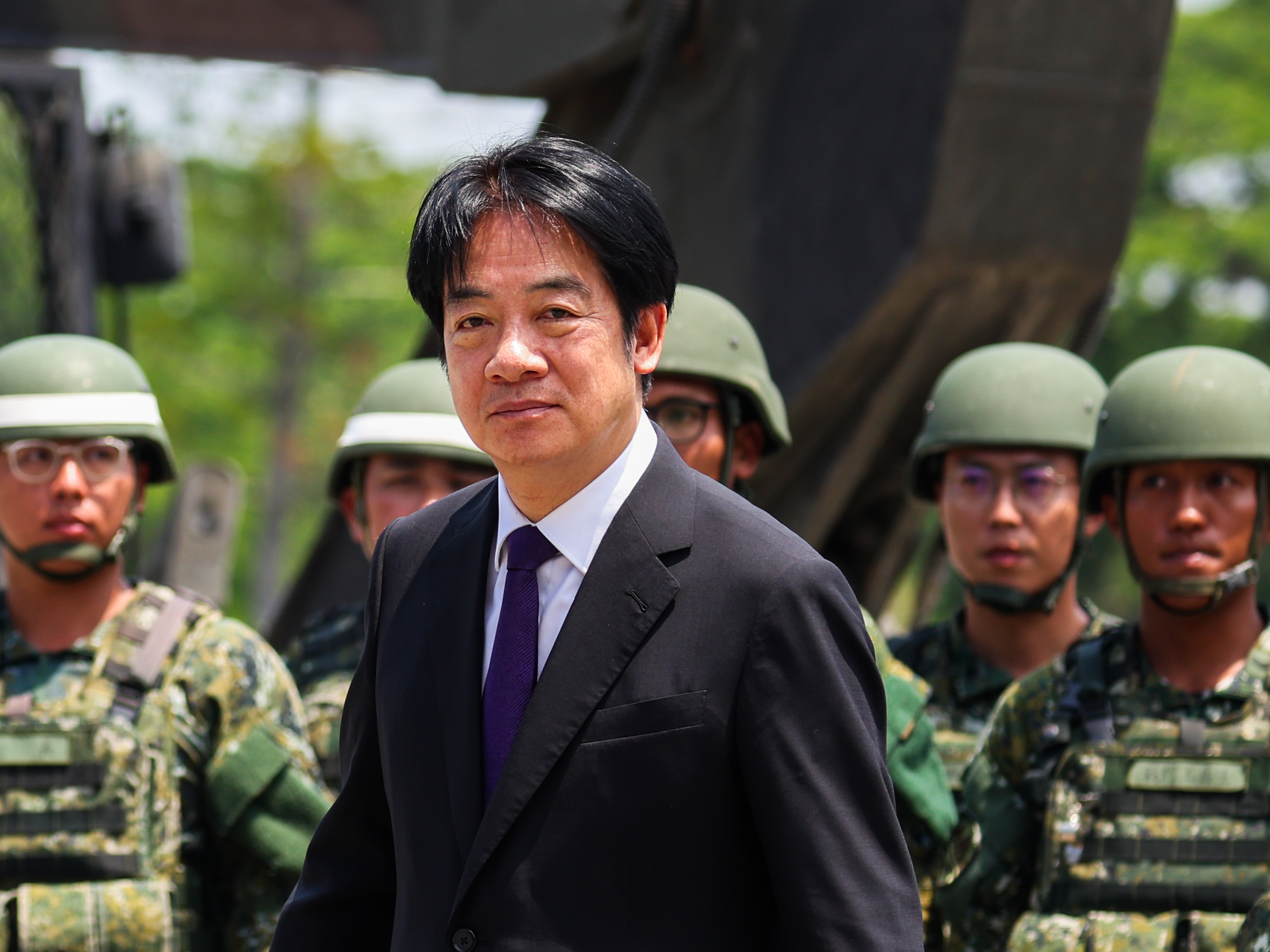 caption: Taiwanese President Lai Ching-te visits a military base in Kaohsiung, Taiwan, on May 16, 2025. Lai has pushed for a major boost to defense spending, but opposition parties have slowed his plans.