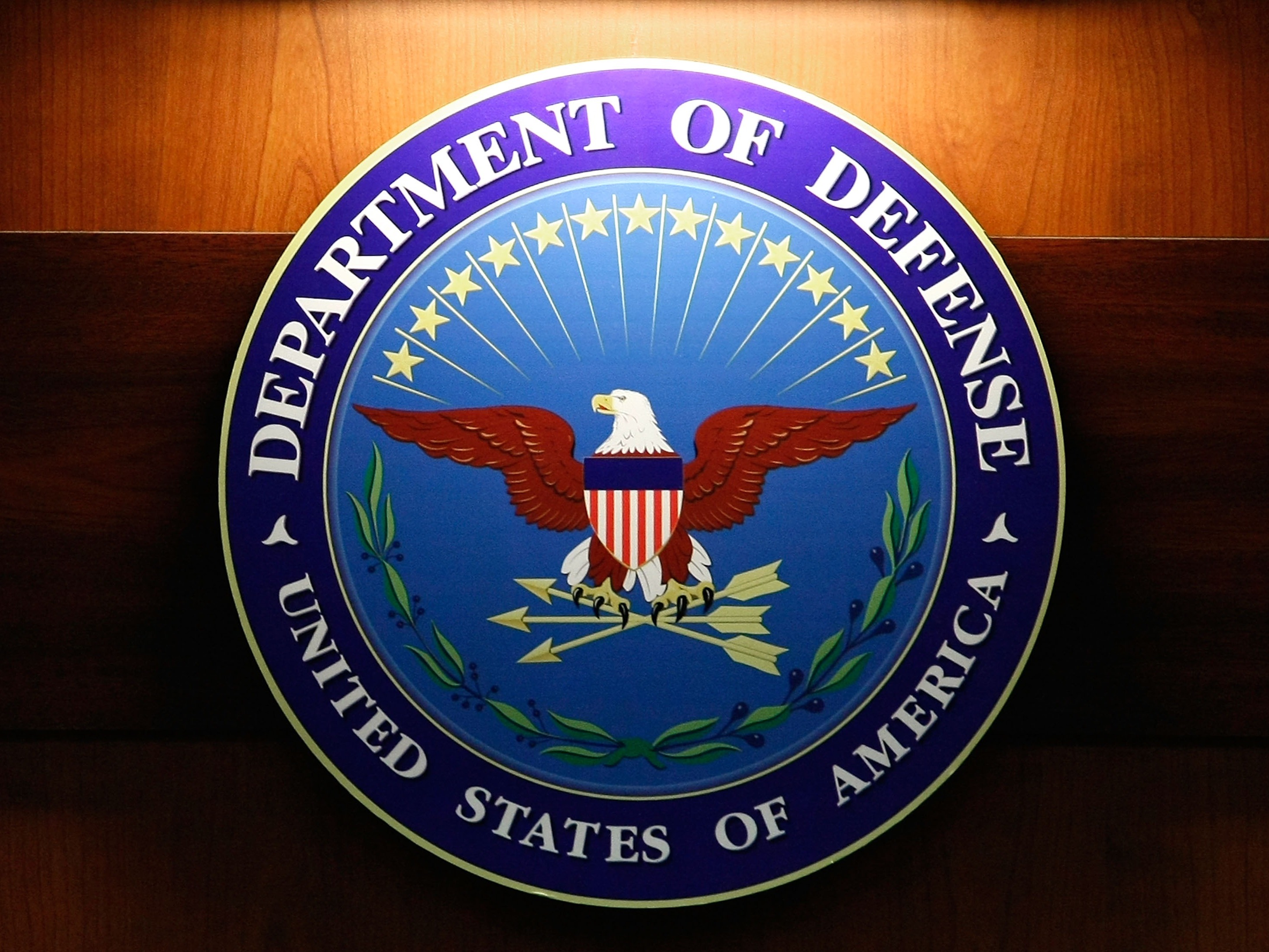 caption: The seal of the Department of Defense at the Pentagon.