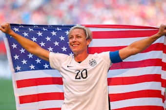 caption: Abby Wambach celebrates the U.S. team's victory against Japan in the FIFA Women's World Cup on July 5, 2015.