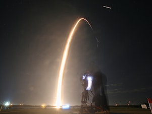 caption: Intuitive Machines' Odysseus lunar lander was carried into orbit by a SpaceX Falcon 9 rocket on Feb. 15.