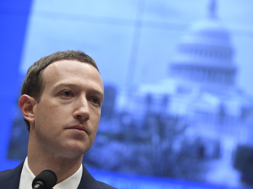 caption: Facebook's Oversight Board says the company, led by CEO Mark Zuckerberg, must take responsibility for its decisions.