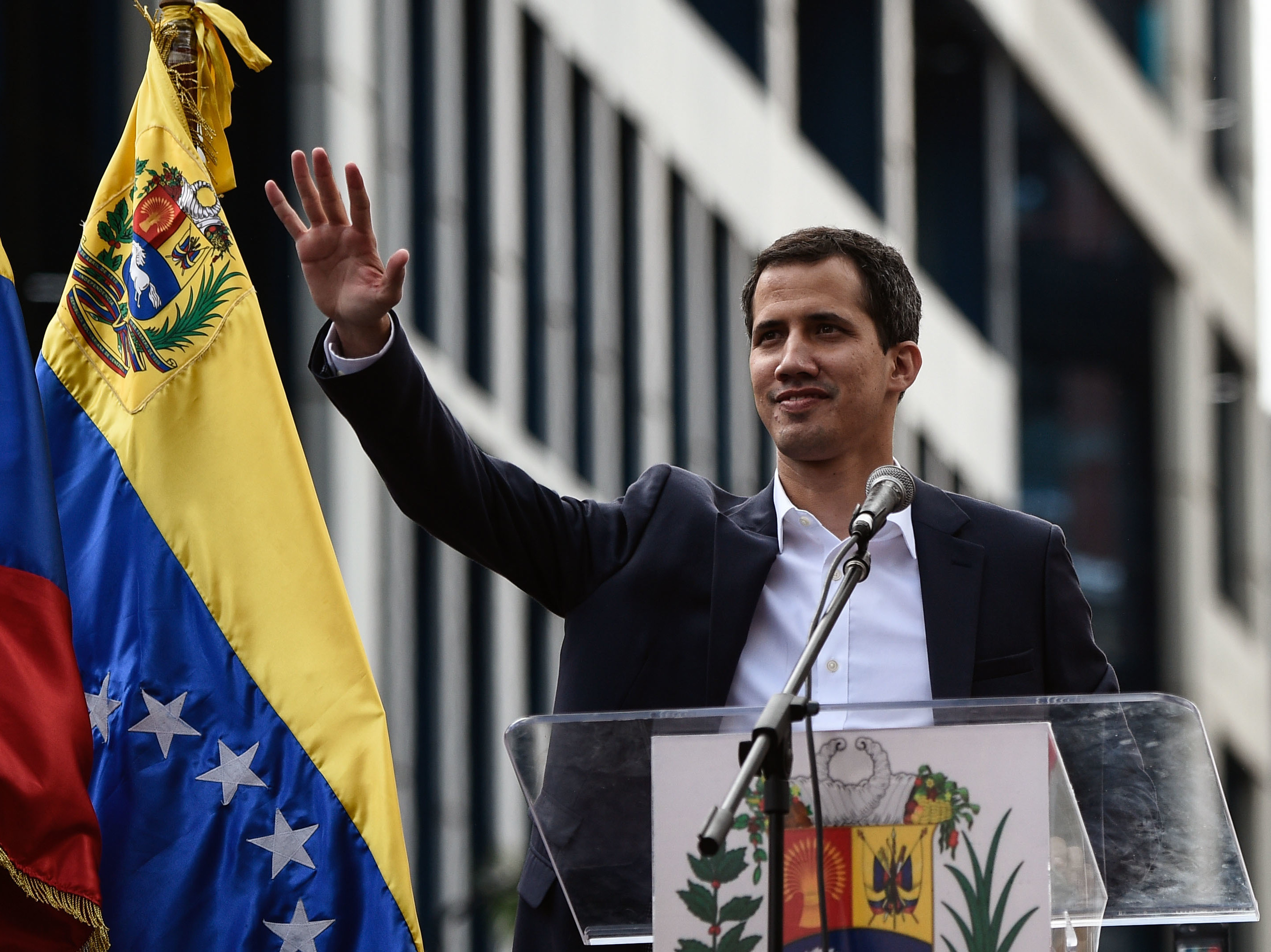 caption: Venezuela's National Assembly head Juan Guaidó waves during a mass opposition rally, during which he declared himself the country's acting president on Jan. 23.