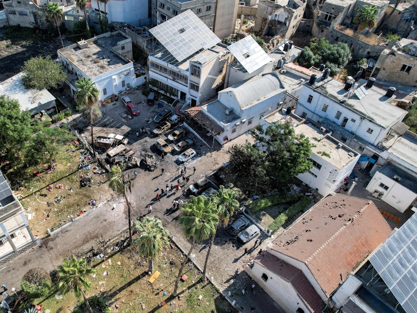 caption: An aerial view of the complex housing the Ahli Arab hospital in Gaza City after an explosion on the hospital grounds that killed hundreds, according to Palestinian officials. Unraveling the facts behind the explosion has been made difficult because of swarms of social media accounts spreading false information about the explosion.