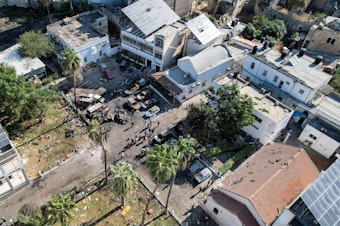 caption: An aerial view of the complex housing the Ahli Arab hospital in Gaza City after an explosion on the hospital grounds that killed hundreds, according to Palestinian officials. Unraveling the facts behind the explosion has been made difficult because of swarms of social media accounts spreading false information about the explosion.