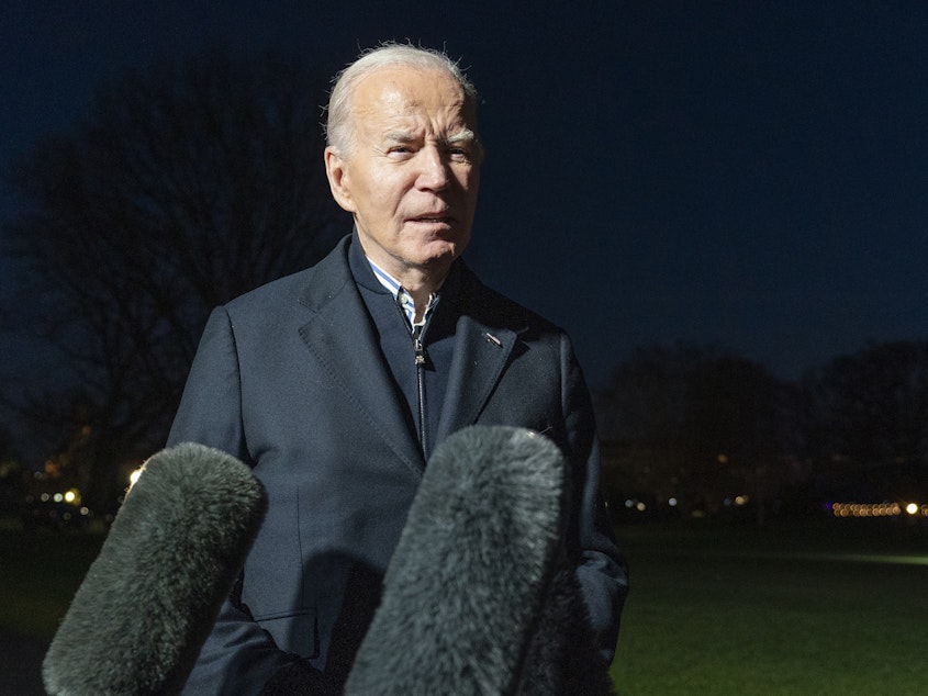 caption: President Biden answers a reporter's question as he walks from Marine One upon arrival on the South Lawn of the White House, Dec. 20, 2023, in Washington, D.C.