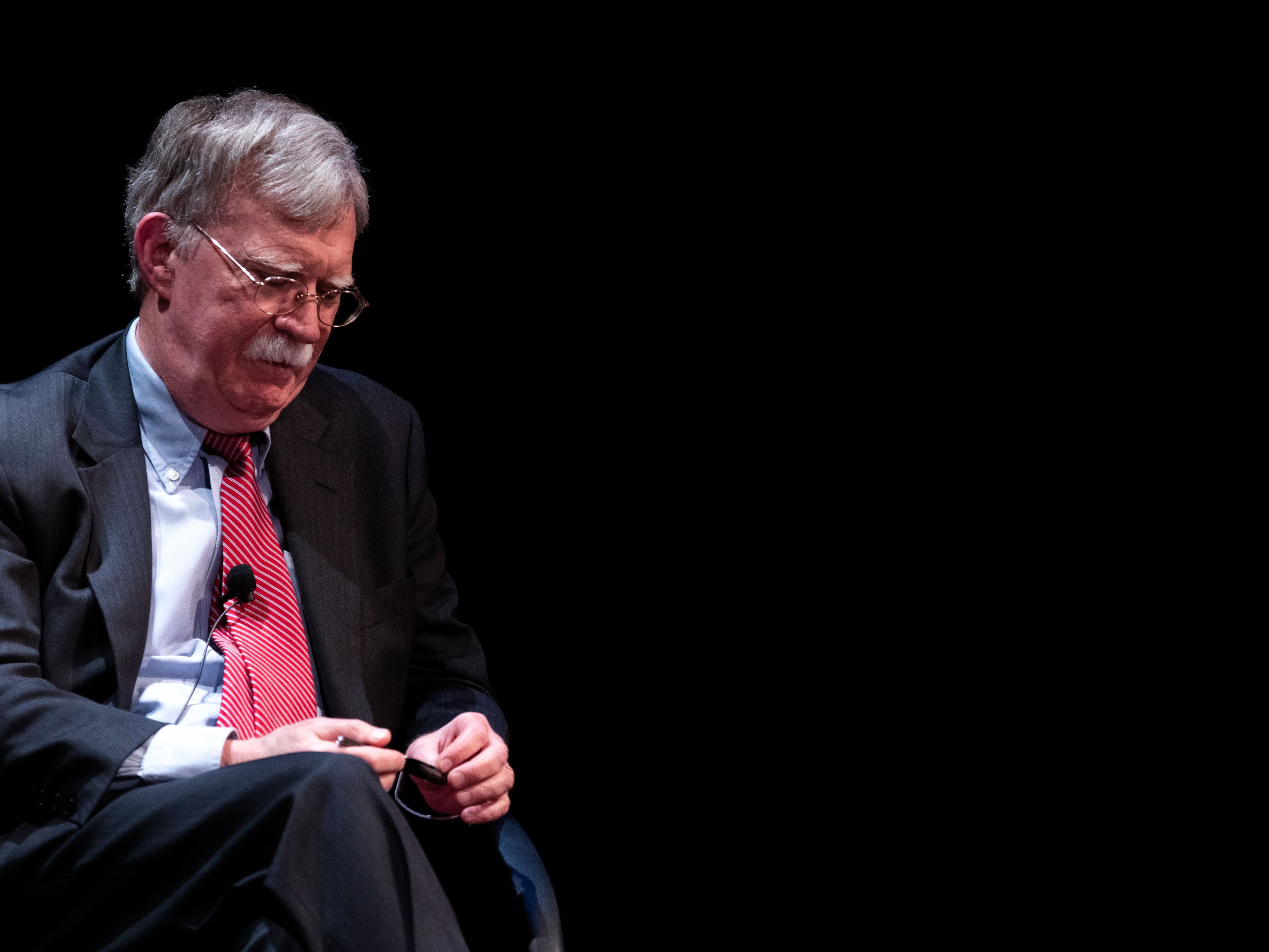 caption: Former national security adviser John Bolton speaks at Duke University in Durham, N.C., on Feb. 17, 2020.