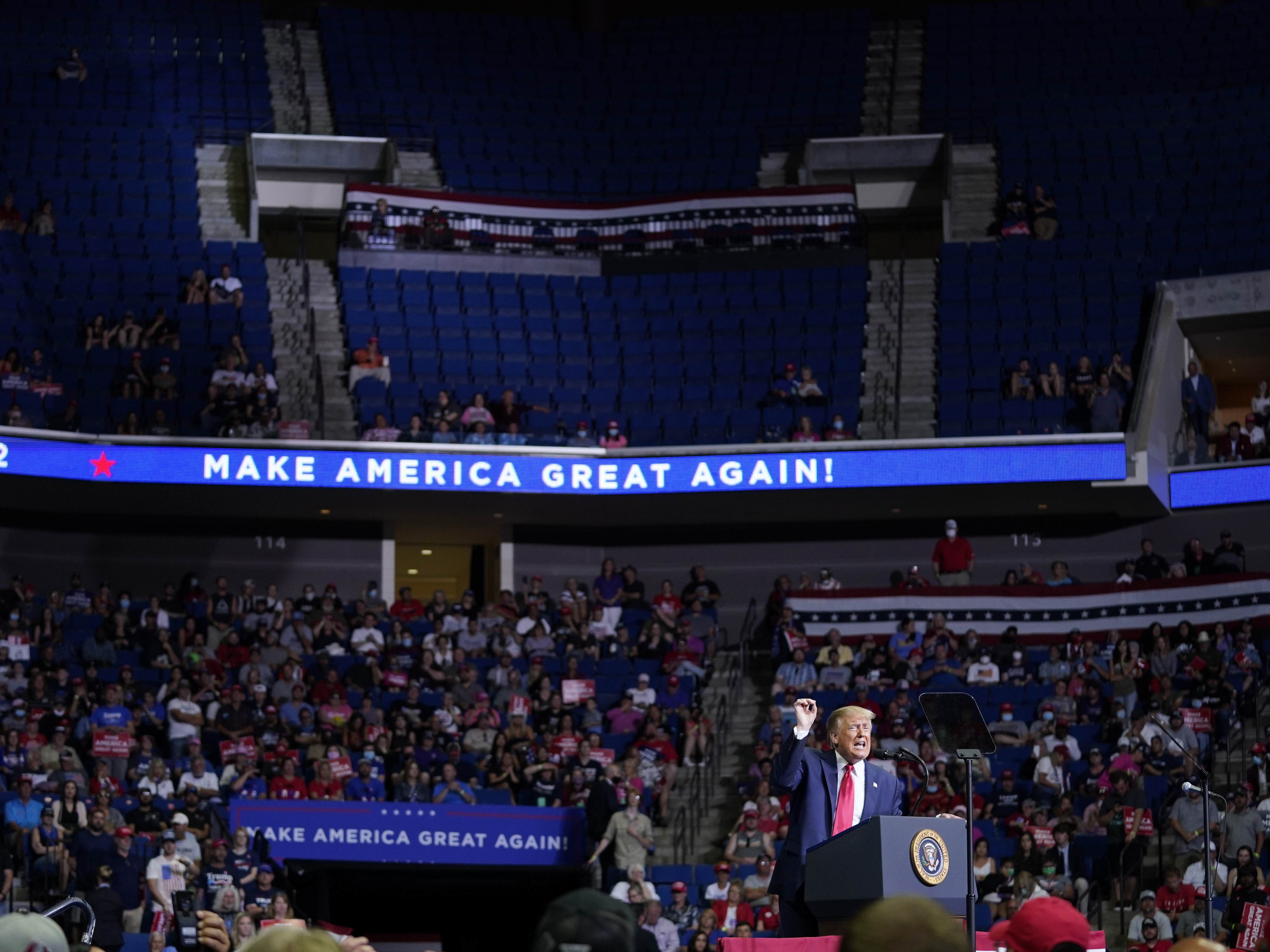 caption: President Trump speaks during a campaign rally on Saturday at the BOK Center in Tulsa, Okla.