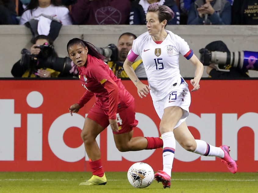 caption: The U.S. Women's National Soccer Team could qualify for the 2020 Olympics with a win over Mexico on Friday. U.S. forward Megan Rapinoe (right) moves against Panama's Maryorie Perez during a CONCACAF match last month in Houston.