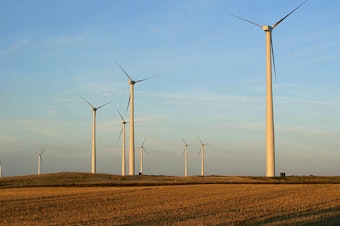 caption: A windfarm near Velva, North Dakota. Two counties in the state have enacted drastic restrictions on new wind projects in an attempt to save coal mining jobs, despite protests from landowners who'd like to rent their land to wind energy companies.
