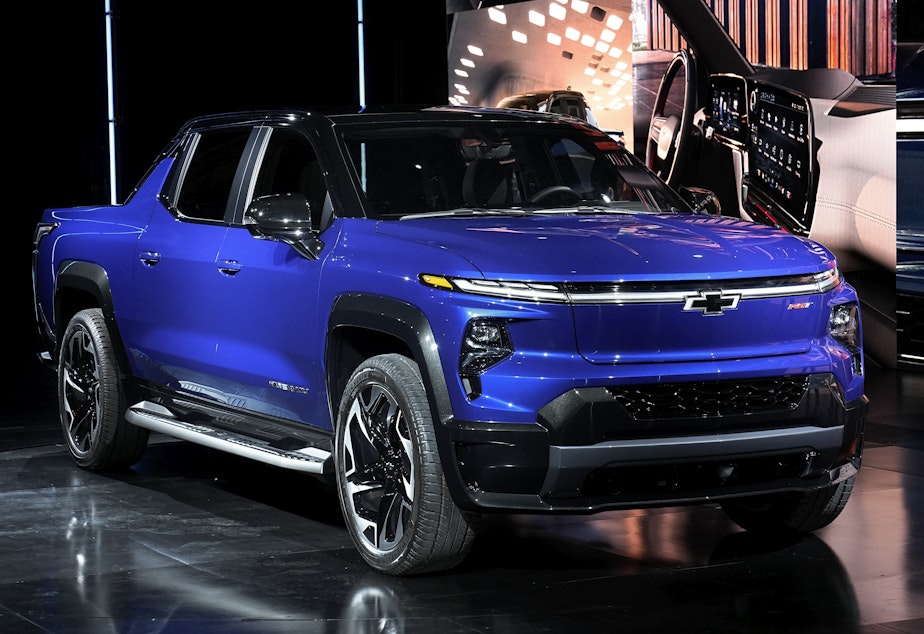 caption: The 2024 Chevrolet Silverado EV RST is shown in Detroit on Jan. 5. General Motors is in a pilot program with Pacific Gas & Electric to use electric vehicles as a backup power source for homes.