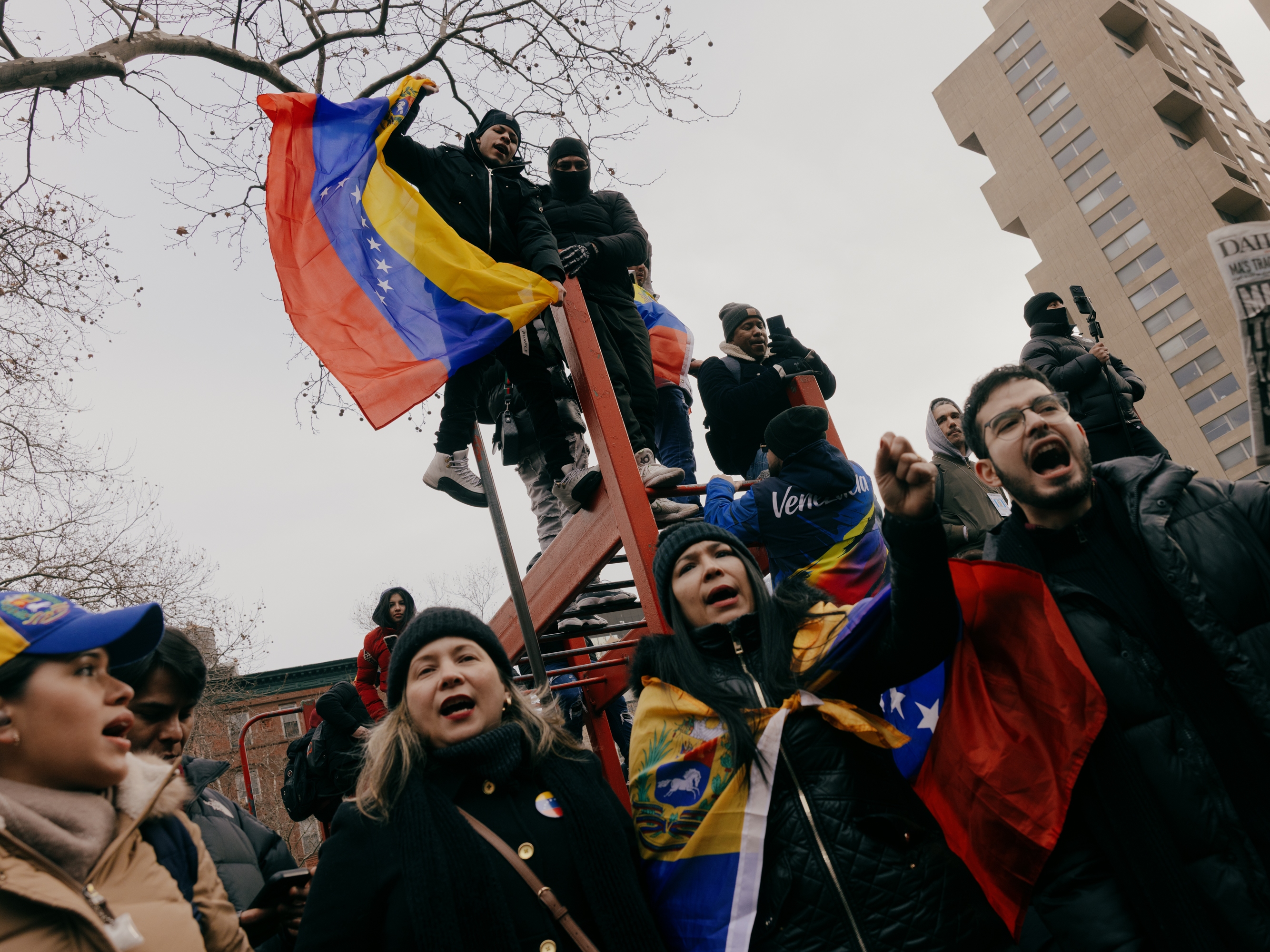 caption: Anti-Maduro demonstrators fly Venezuelan flags outside the federal courthouse in Lower Manhattan, New York, on Monday, January 5.