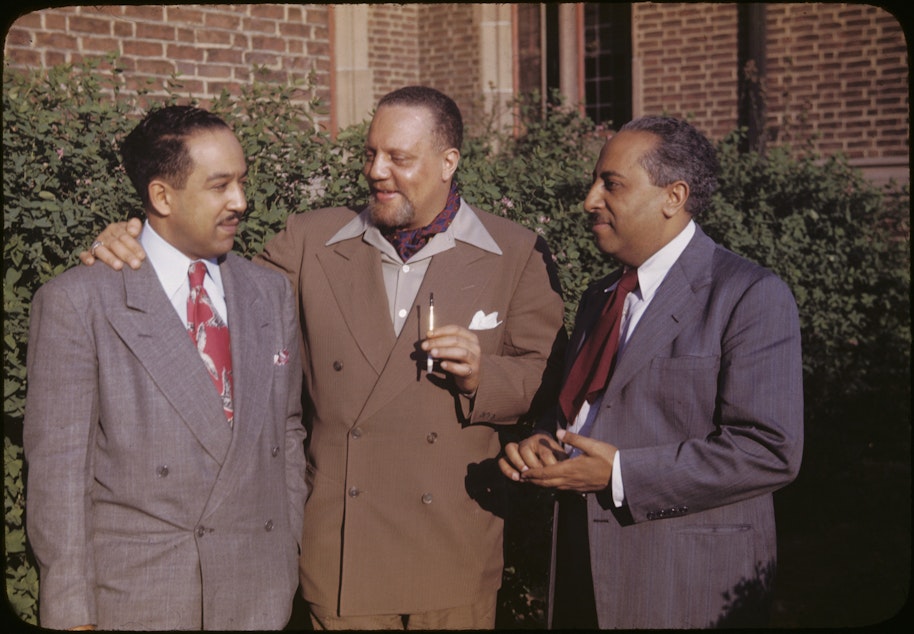 caption: Horace Cayton Jr., center, as an adult. Cayton worked many jobs before becoming an esteemed sociologist in Chicago - longshoreman and Seattle's first black deputy, among others.