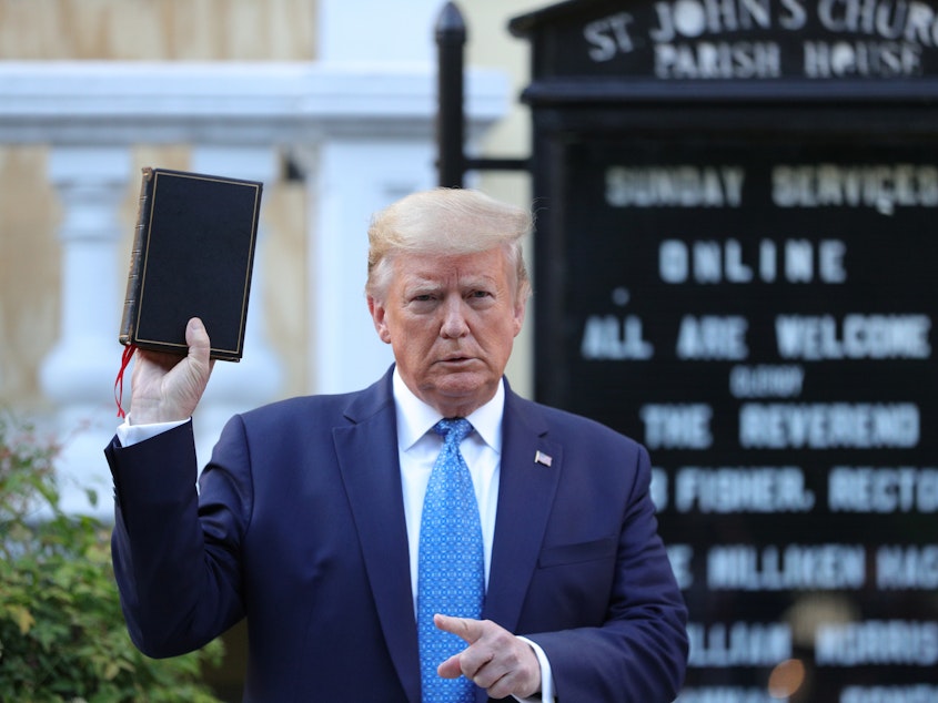 caption: President Trump's photo opportunity in front of St. John's Episcopal Church in Washington has set off criticism, as police used tear gas and force to clear a path for him to walk from the White House.